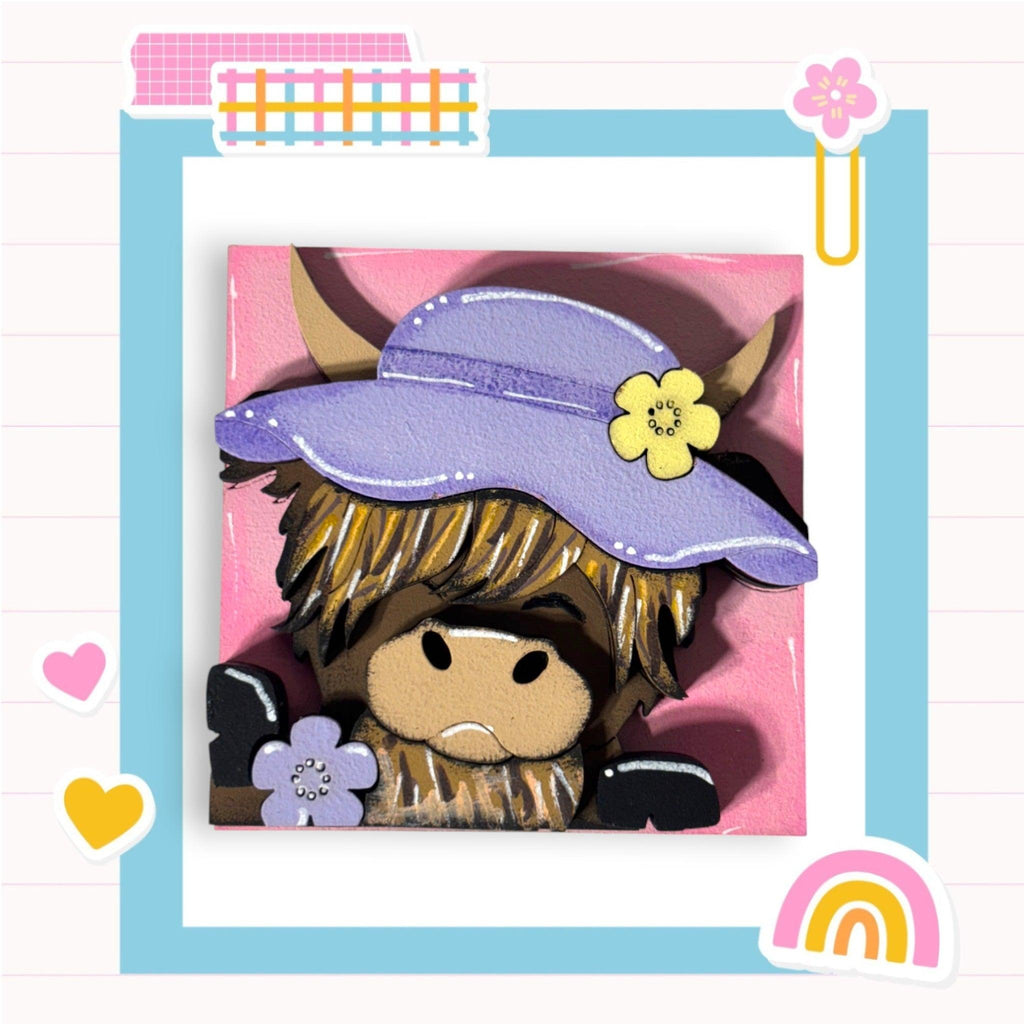 a picture of a stuffed animal wearing a purple hat