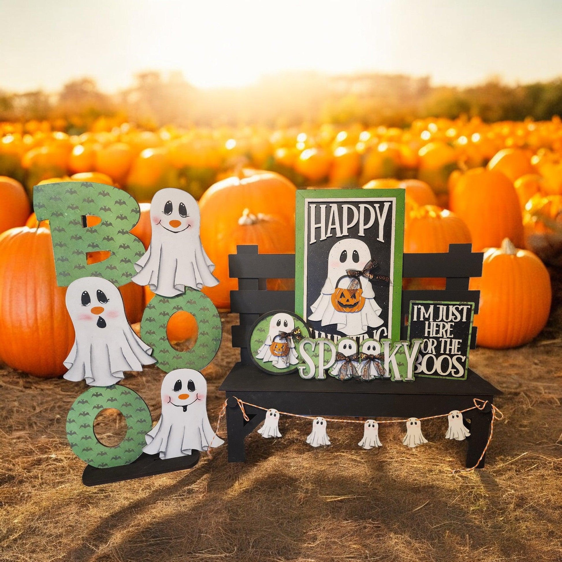 a table topped with halloween decorations and pumpkins