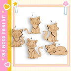 a collection of five wooden cat figurines, each with a unique pose, arranged in a row against a white background.