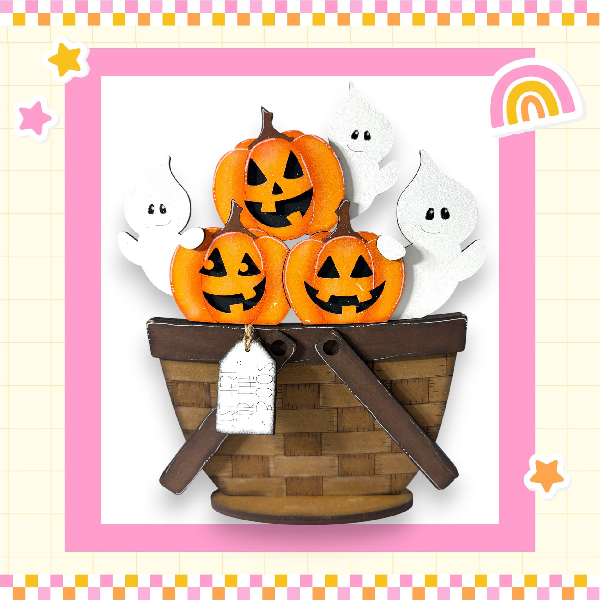 A basket filled with carved pumpkins and ghostly figures, set against a pink and yellow checkered background.