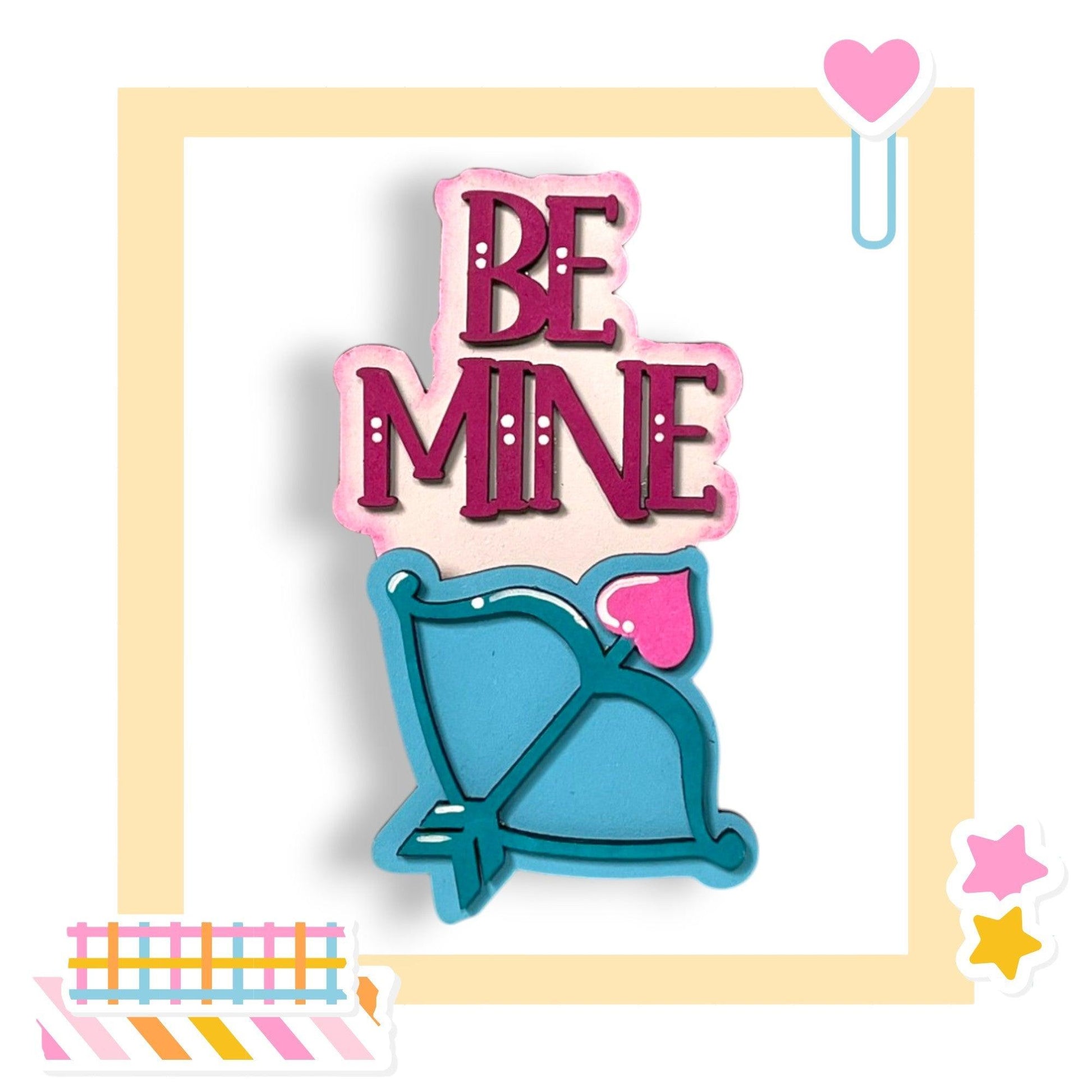 a cookie with the words be mine on it