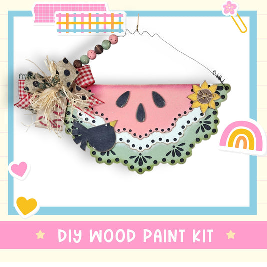 a picture of a watermelon decoration with a rainbow in the background