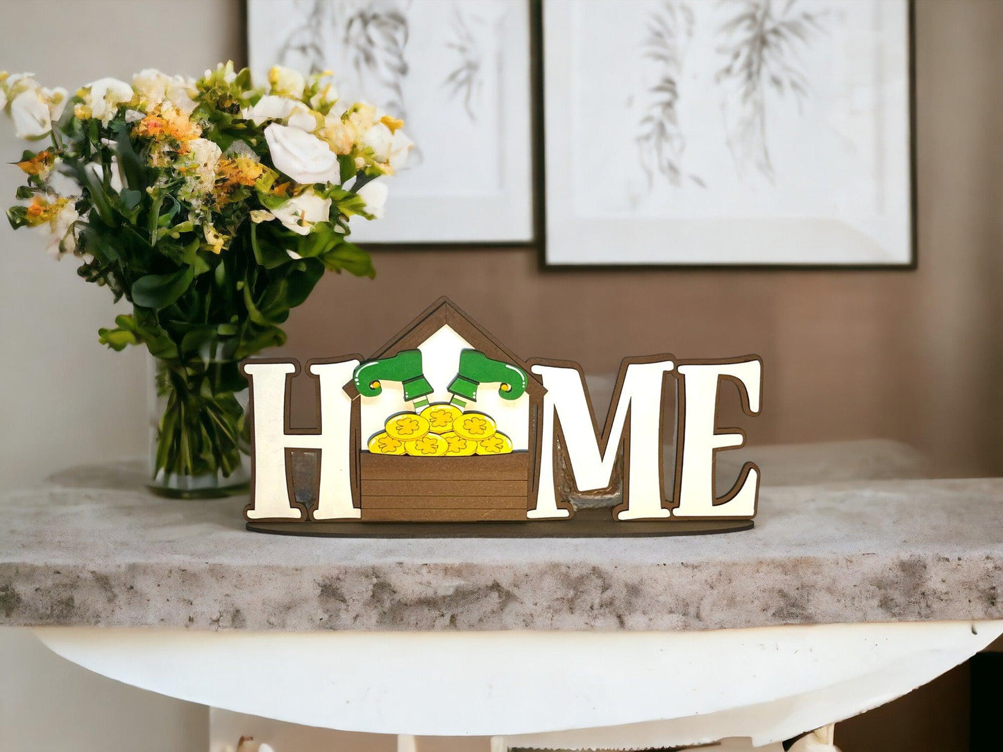 a home sign sitting on top of a table next to a vase of flowers