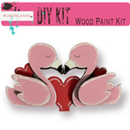 a pair of pink flamingos holding a red heart