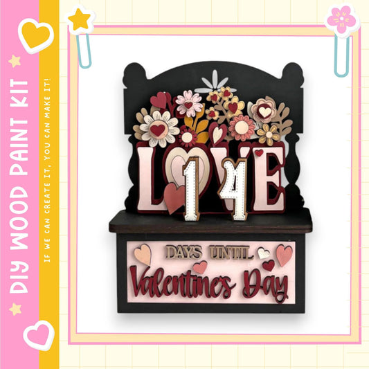 A wooden sign with the number 14 and the text "LOVE 14 DAYS UNTIL VALENTINE'S DAY" displayed on it.
