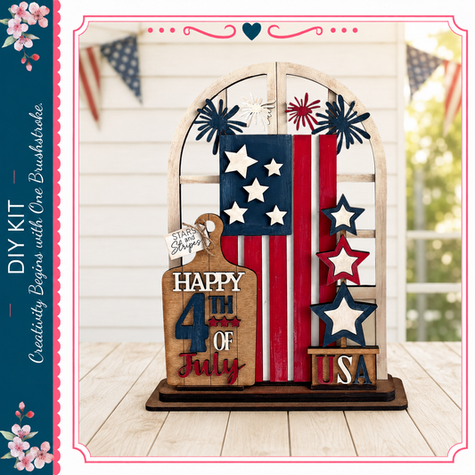 A wooden sign with a patriotic design, featuring an American flag, stars, and a "Happy 4th of July" message, placed on a wooden surface.
