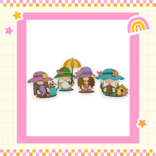 A group of four whimsical gnomes wearing colorful hats and holding umbrellas, set against a pink and yellow checkered background with stars and a rainbow.