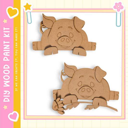 two wooden cutouts of smiling pigs, one on top of the other, set against a pink and yellow background.