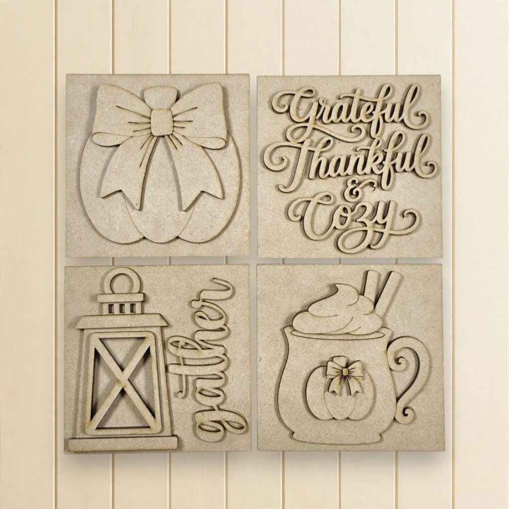 The image is a collage of four wooden cutouts, each depicting a different fall-themed item or decoration. The cutouts include a bow, a lantern, a mug with whipped cream, and a pumpkin.