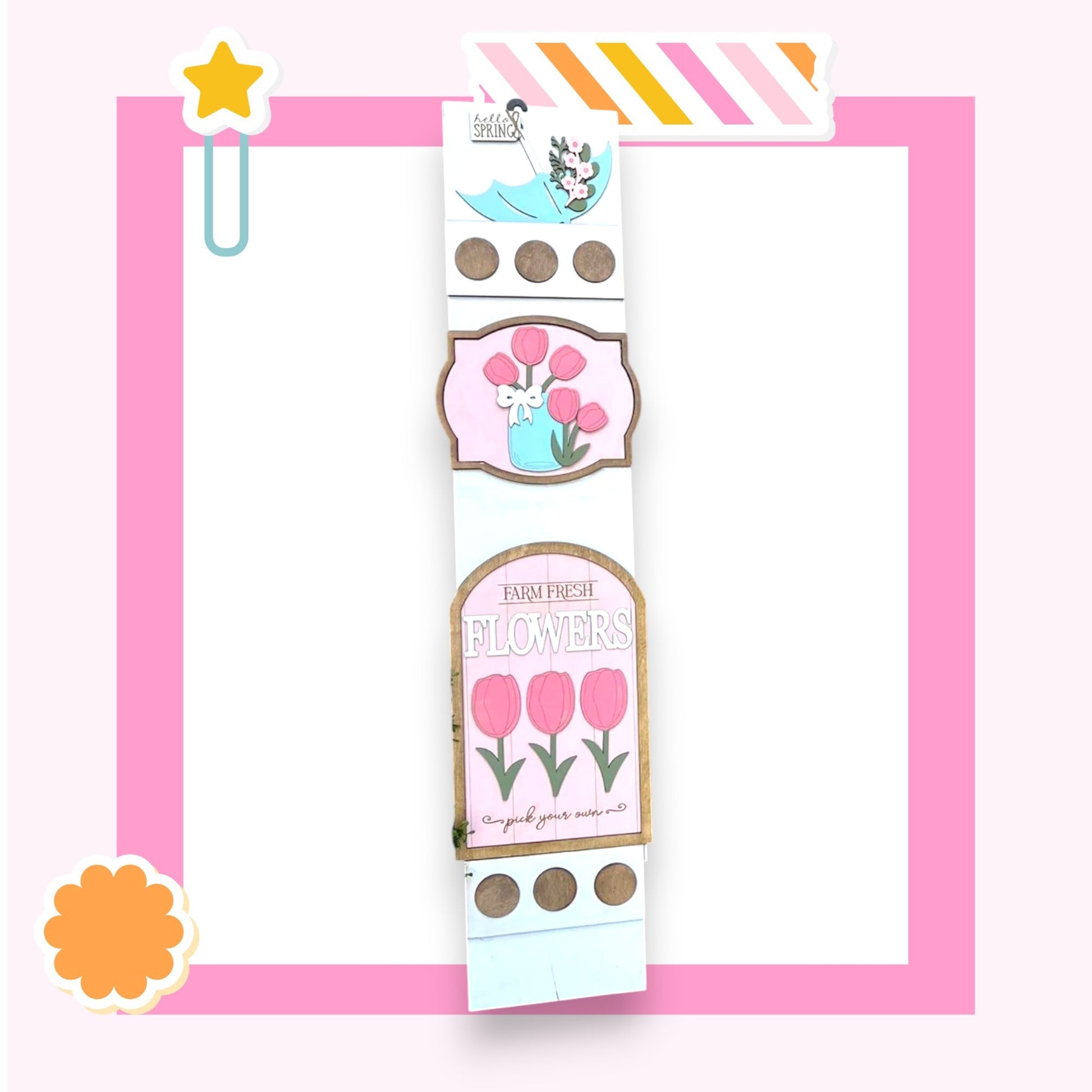 a pink and white floral design with a star decoration, surrounded by a pink border.