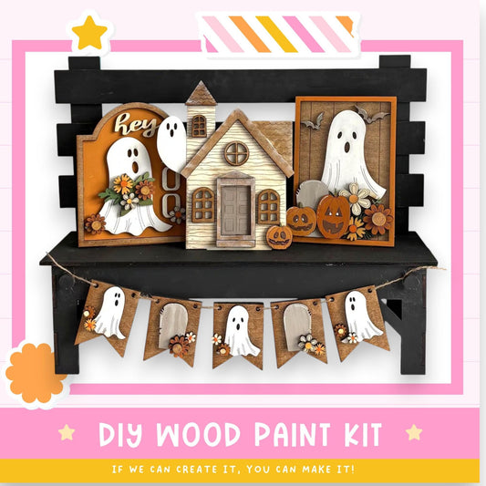 The image is a Halloween-themed DIY wood paint kit, featuring various wooden decorations such as ghost houses, pumpkins, and banners.
