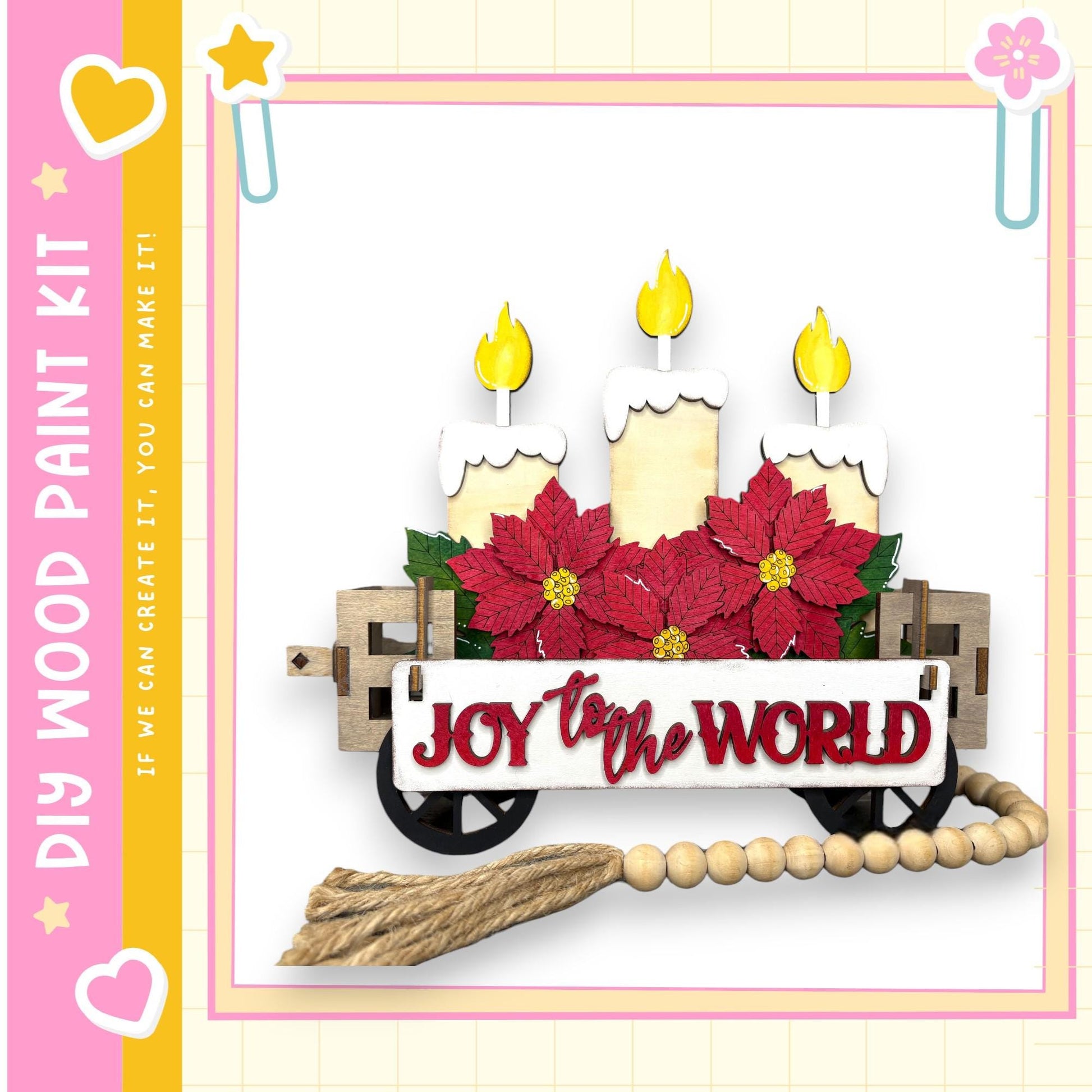 A wooden wagon decorated with poinsettia flowers and three lit candles, with the text "Joy to the World" displayed on the wagon.