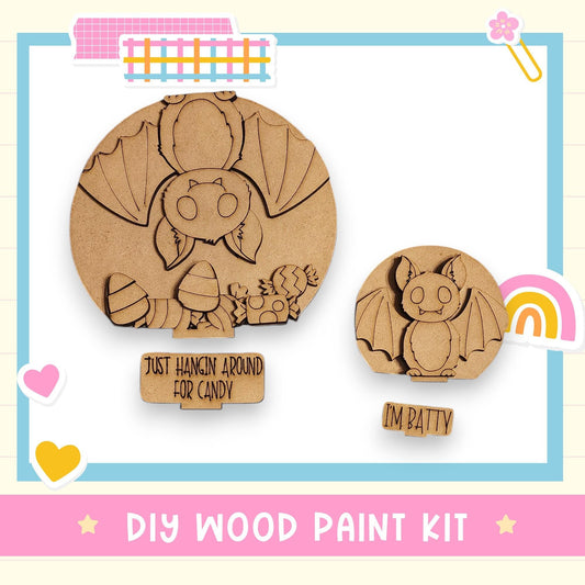 a DIY wood paint kit for creating wooden bats, with two wooden bat-shaped cutouts displayed.