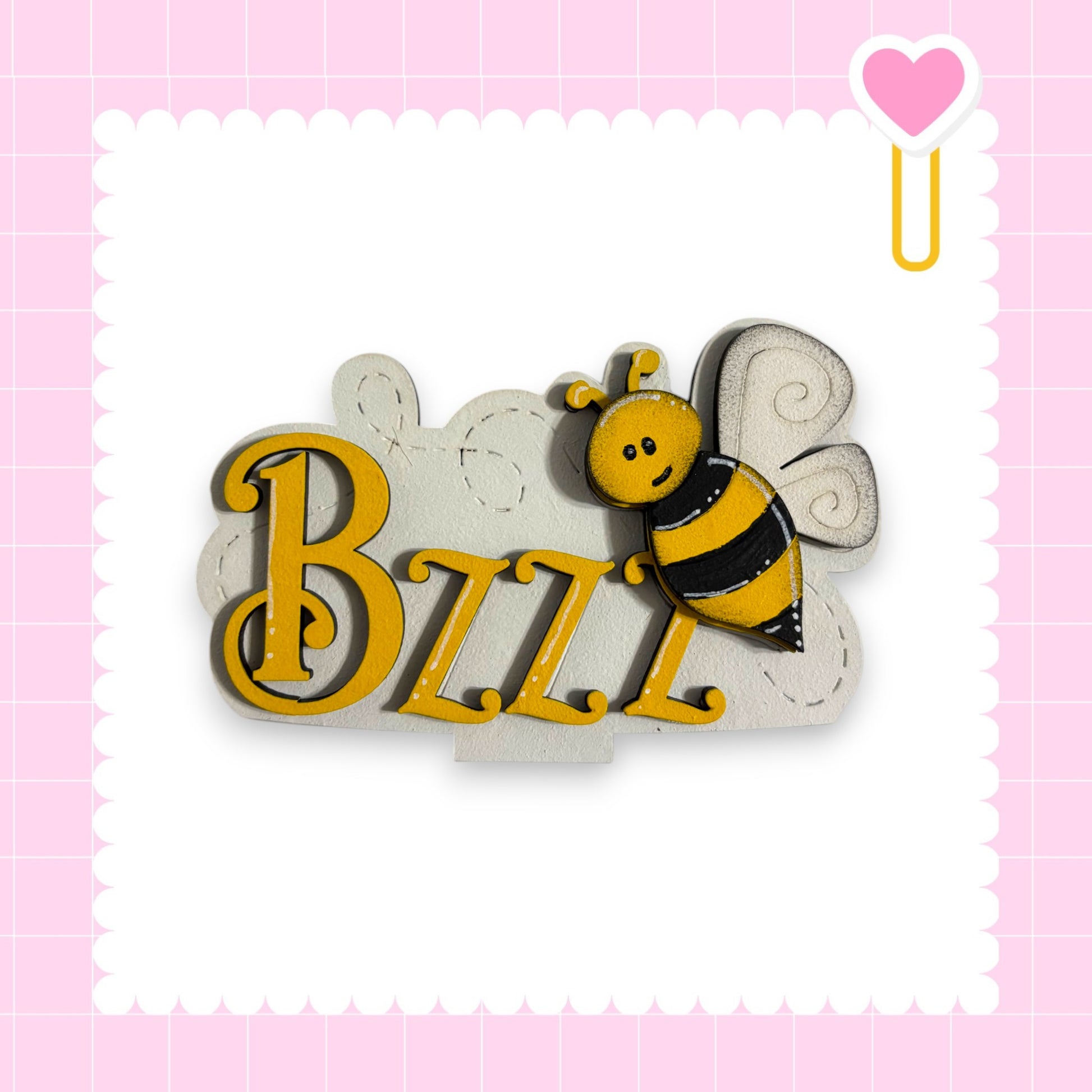 A wooden sign with the name "BZZZ" in large yellow letters, featuring a bee-like design.