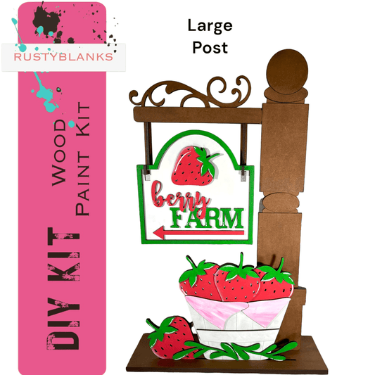 a wooden sign with a bowl of strawberries on it