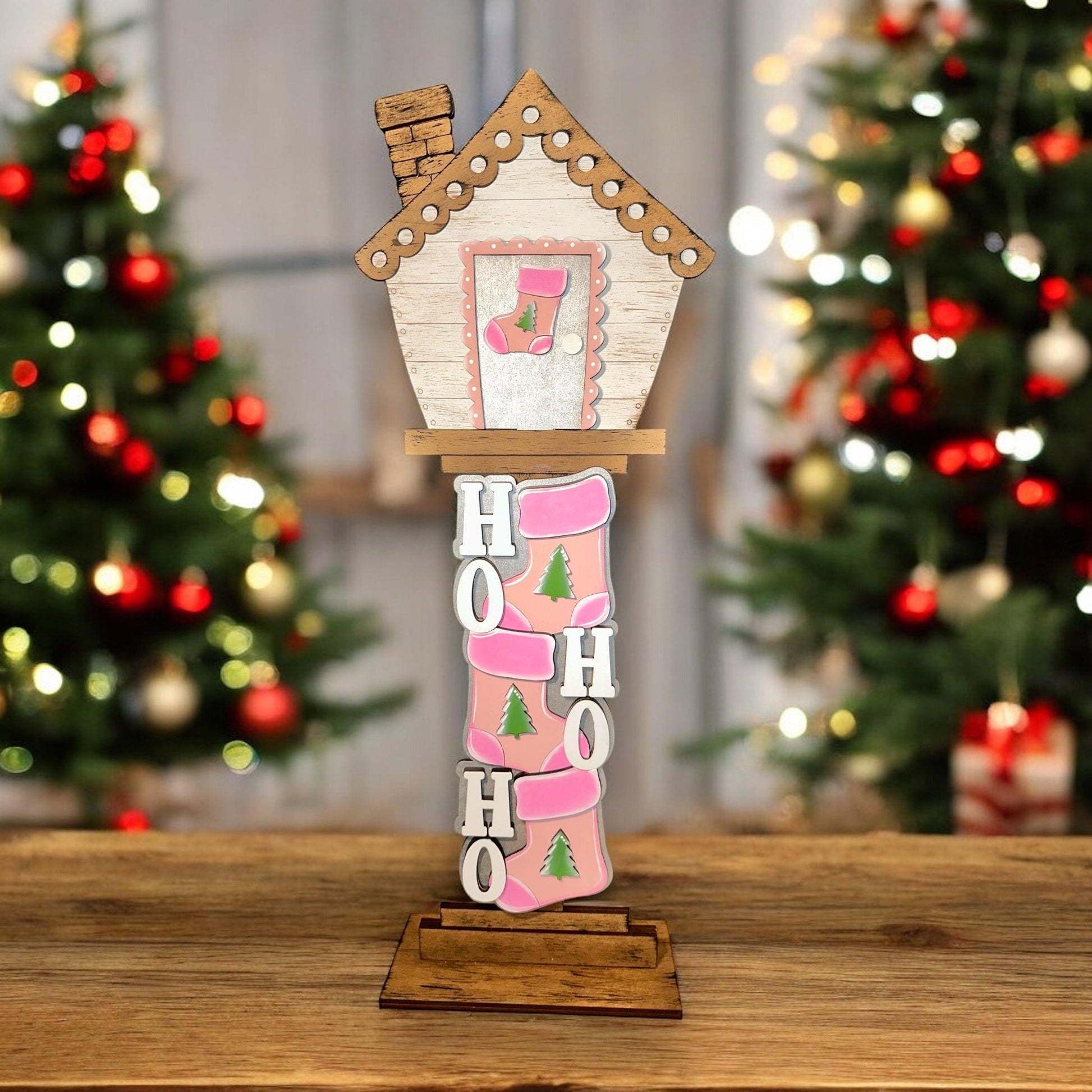 a wooden house with a christmas tree in the background