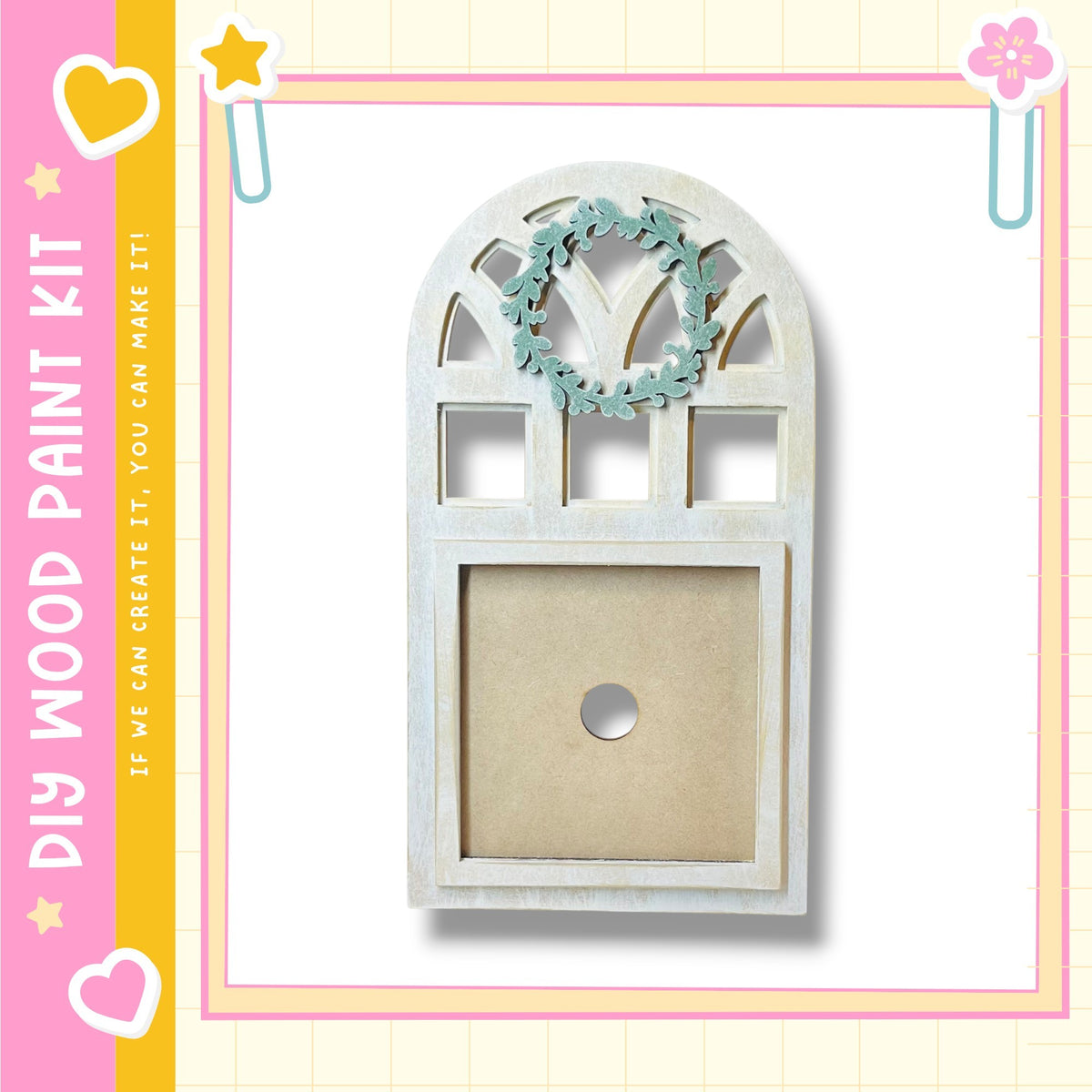 a wooden frame with a wreath hanging on it, set against a pink and yellow background with decorative elements.