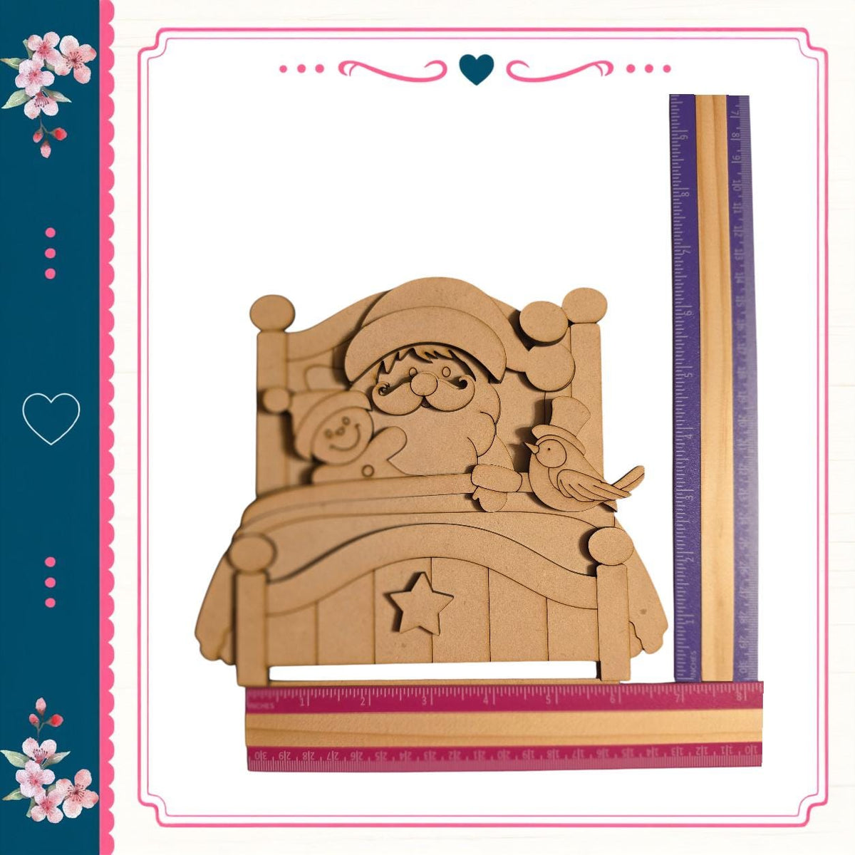 A wooden Santa Claus figure sitting on a bed, with a bird perched on his shoulder. The Santa figure is made of wood and appears to be carved. The bed is made of wood and has a star on it. The image also includes a ruler and a heart, suggesting it may be a decorative or artistic piece.