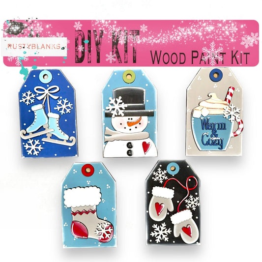 a set of four christmas gift tags with snowmen