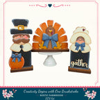 a set of three wooden figures representing a turkey, a man, and a woman, all decorated for the Thanksgiving holiday. The turkey figure is the central focus, with the man and woman figures positioned around it. The figures are set against a white background, and the image includes text that reads "Creativity Begins with One Brushstroke. Rustic Farmhouse DIY Kit".