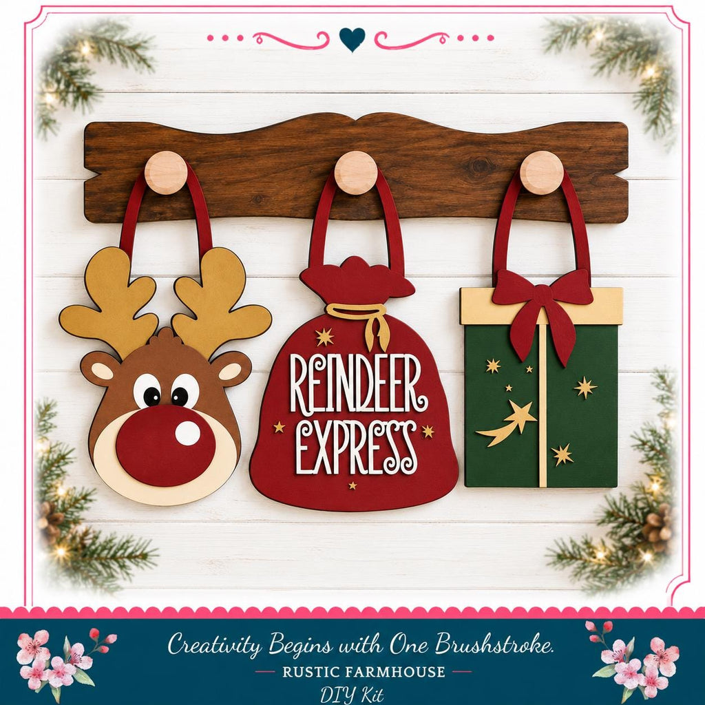 A festive arrangement of three wooden ornaments, including a reindeer, a gift bag, and a star, displayed on a wooden shelf against a white background with greenery and holiday decorations.