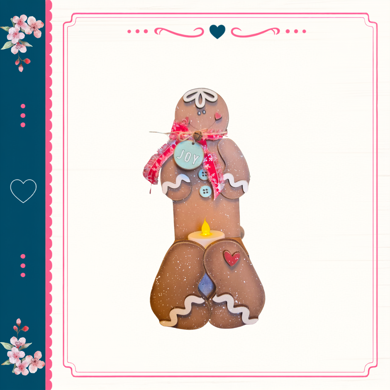 A gingerbread man figure with a "Joy" sign on its chest, standing on a white background with a decorative border.