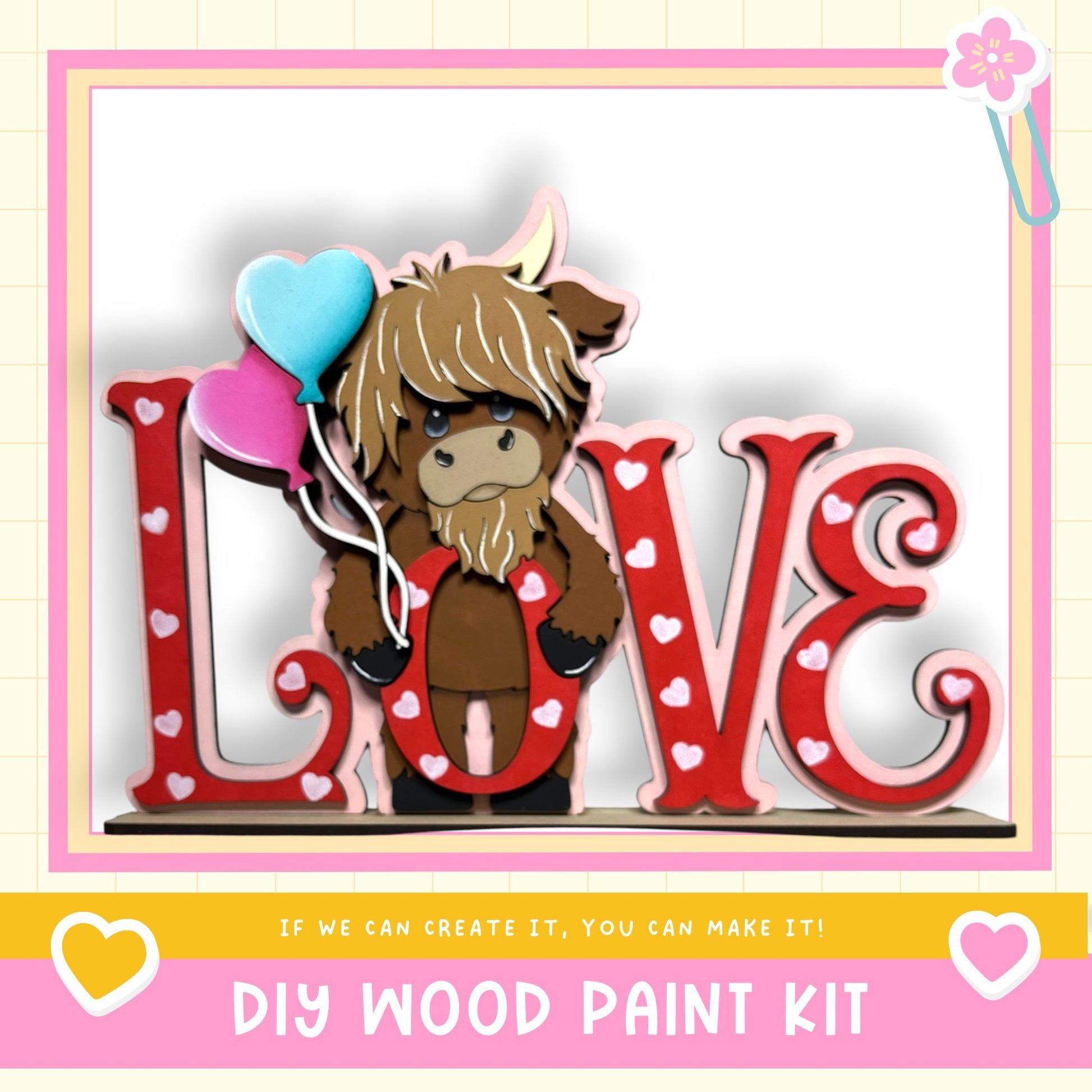 A wooden sign with the word "LOVE" written on it, featuring a cartoon character holding balloons. The sign is surrounded by heart-shaped decorations.