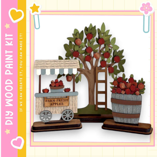 A wooden apple orchard with a tree and two wooden barrels filled with apples, set against a pink and yellow background.