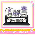 a wooden sign that has some flowers in it