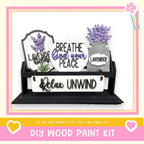 a wooden sign that has some flowers in it