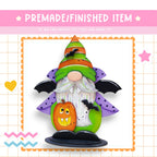 a paper craft of a halloween gnome with a pumpkin