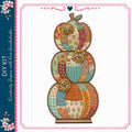 A colorful, decorative pumpkin-shaped object with various patterns and designs, including flowers, leaves, and geometric shapes.