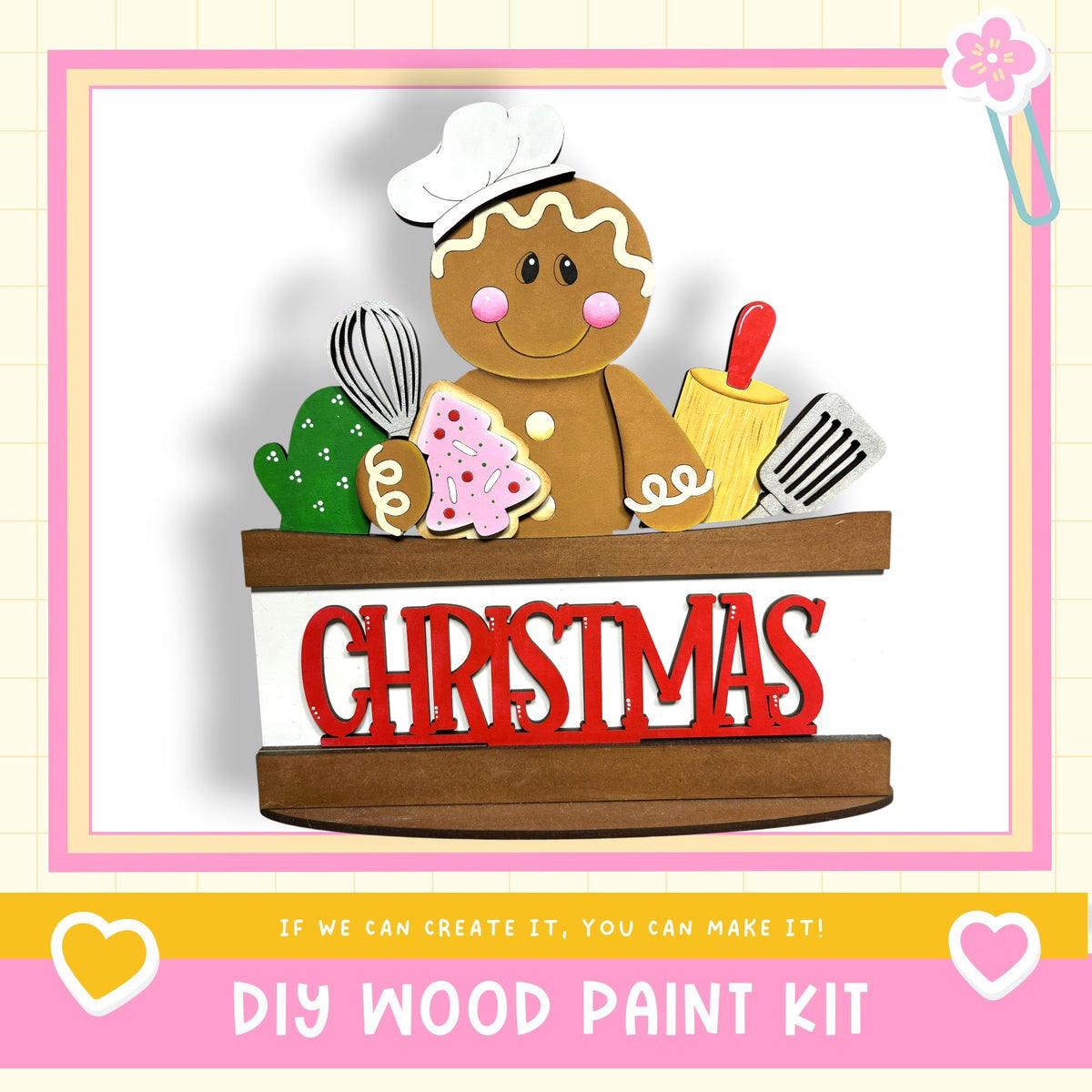 A wooden gingerbread man figure holding various baking tools, with the word "CHRISTMAS" written on a wooden sign below.