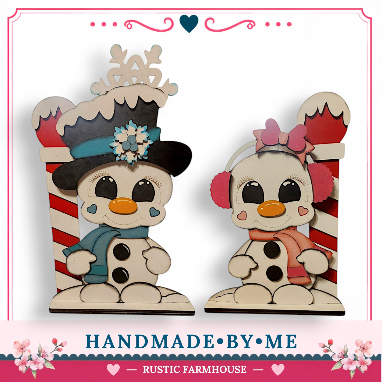 two snowmen, one wearing a black top hat and the other wearing a pink bow, sitting on a red and white striped pole.
