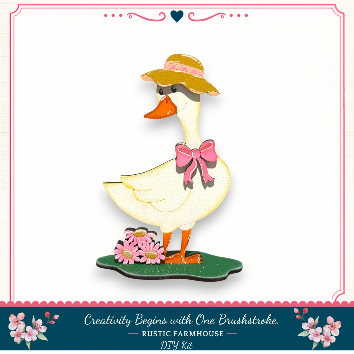 A wooden duck wearing a hat and bow, standing on a green platform with flowers, against a white background.