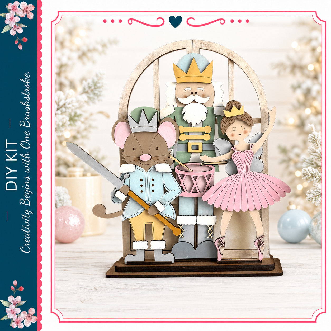 A wooden nutcracker figure holding a sword and a mouse figure, with a fairy figure in a pink dress, set against a snowy background with Christmas decorations.