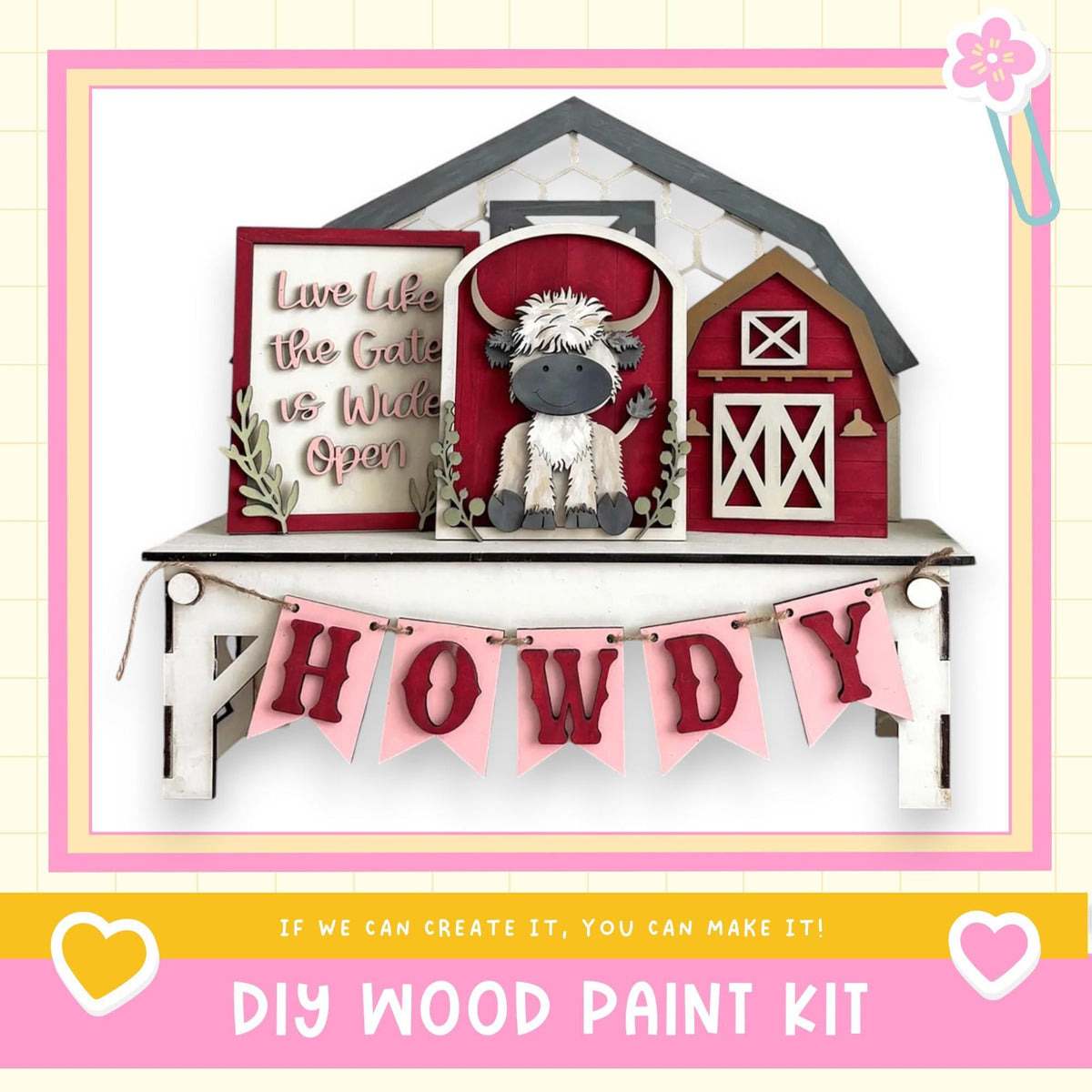 a DIY wood paint kit for creating a wooden sign with a cow and the word "HOWDY" displayed on it. The sign is mounted on a shelf, and there is a banner hanging below it. The image also includes a heart symbol and a flower, adding a decorative touch to the overall presentation.