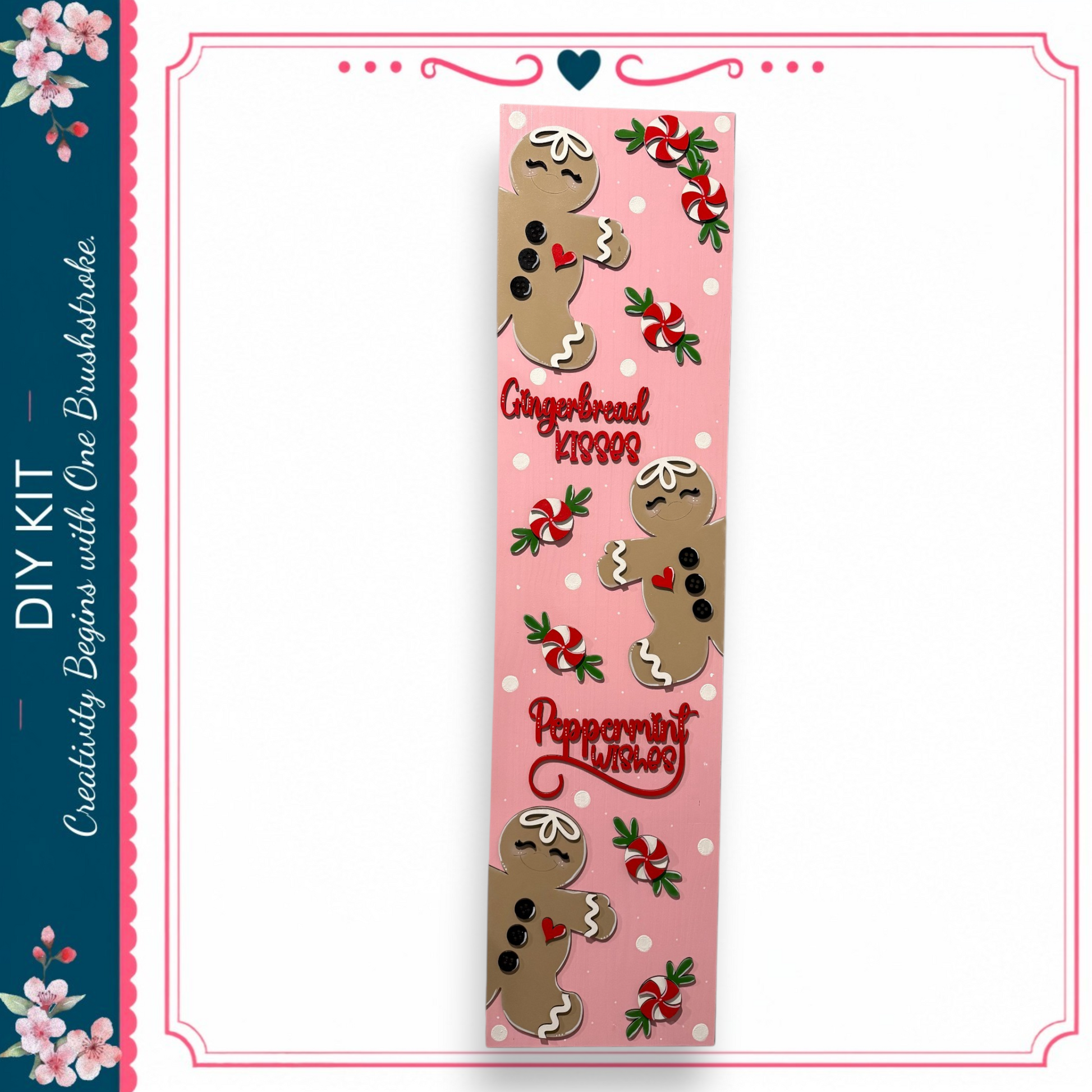 A pink bookmark with a gingerbread man design and peppermint candy decorations.