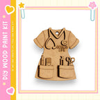 A wooden craft kit depicting a nurse's outfit with various tools and accessories, such as a stethoscope, scissors, and a heart.