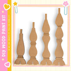 a collection of wooden pieces, including a tall piece, a shorter piece, and a few other pieces, arranged in a row.