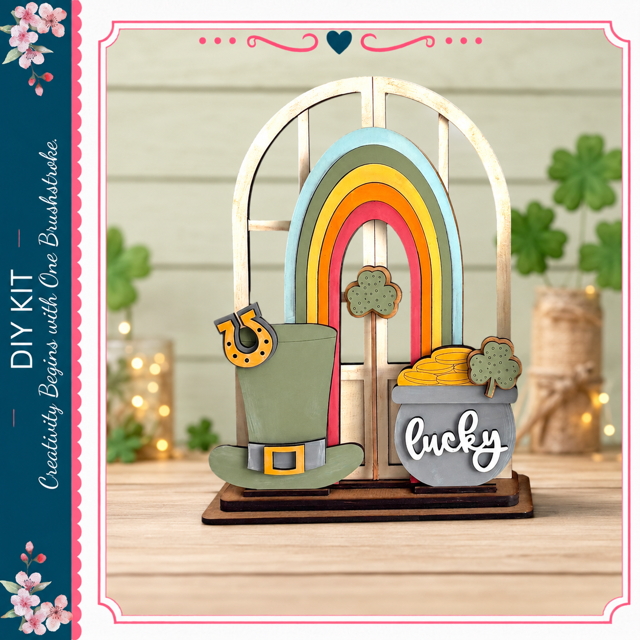 A DIY kit featuring a rainbow-colored arch, a green top hat, a pot of gold coins, and a clover, all set against a background with shamrocks and twinkling lights.