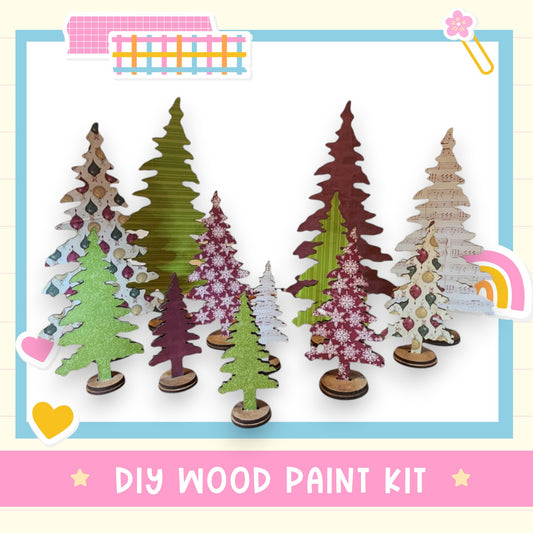 a DIY wood paint kit for creating wooden trees, with a variety of colorful and patterned tree cutouts arranged in a row.