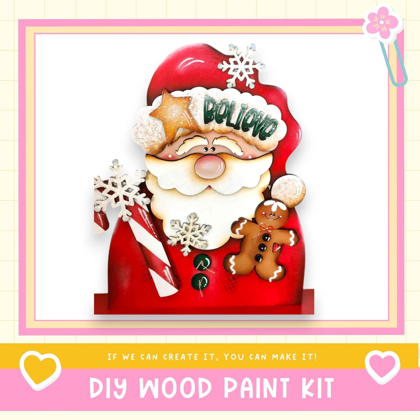 A festive DIY wood paint kit featuring a decorated Santa Claus figure with a gingerbread man and snowflakes, along with the text "If we can create it, you can make it!"