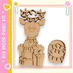 A wooden deer figurine with a bow and a small wooden box with lights on it, both set against a pink and yellow background.