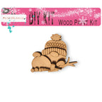 a wooden cutout of a baby bird sitting on a branch