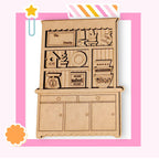 a wooden cutout of a kitchen cabinet