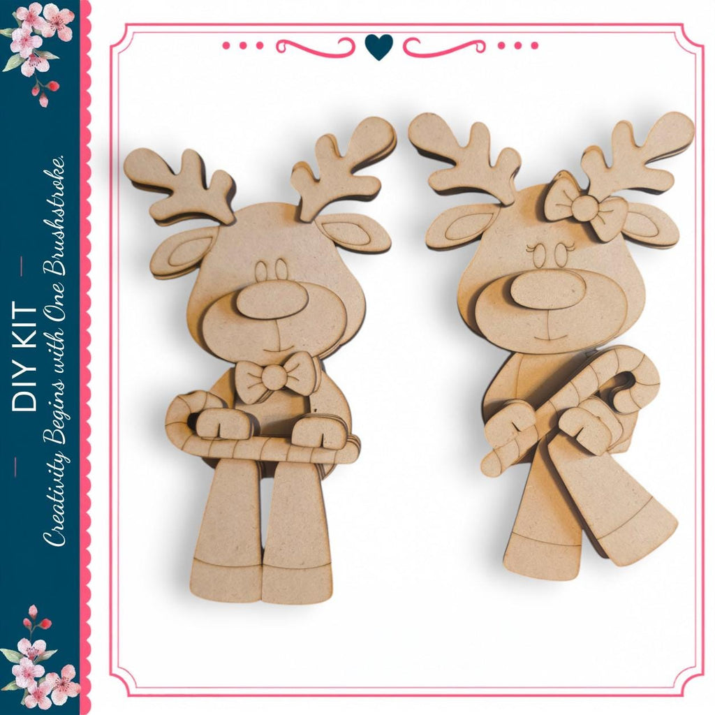 two wooden reindeer figures, one standing upright and the other holding a candy cane, both with antlers and bows.
