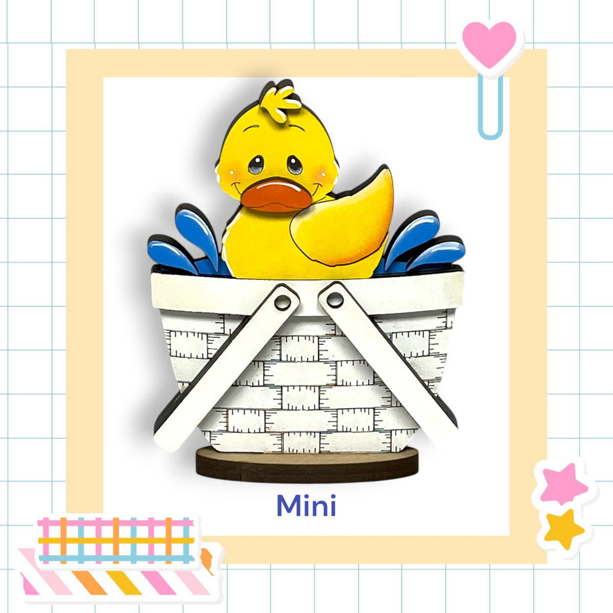 A yellow duck sitting in a basket, surrounded by various colorful and playful elements such as a heart, stars, and a striped pattern.