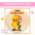 a picture of a yellow duck holding a pink flower