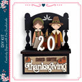 A decorative wooden sign with the number "20" and the phrase "DAYS UNTIL THANKSGIVING" indicating the number of days until Thanksgiving. The sign is set against a black background with a floral border.